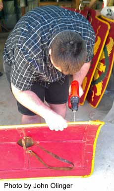 Drilling holes for rawhide thread.